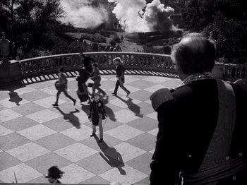 Movie still from “Juarez” (1939), directed by William Dieterle – A group of people standing on top of a checkerboard floor; Wide shot, High angle