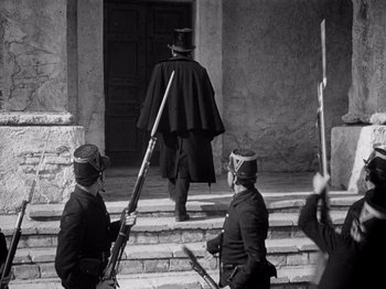 Movie still from “Juarez” (1939), directed by William Dieterle – A group of men standing next to each other on steps; Wide shot, Low angle