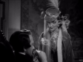 Movie still from “Juarez” (1939), directed by William Dieterle – A man and a woman in an old fashion photo; Close Up shot, Over the shoulder angle