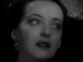 Movie still from “Juarez” (1939), directed by William Dieterle – A black - and - white photo of a woman's face; Close Up shot, High angle