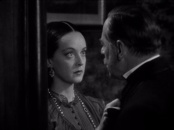 Movie still from “Juarez” (1939), directed by William Dieterle – A man and a woman are looking at one another; Close Up shot, Over the shoulder angle