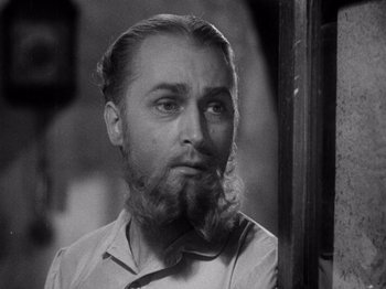 Movie still from “Juarez” (1939), directed by William Dieterle – A black and white photo of a man with a beard; Close Up shot, Low angle