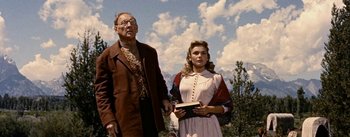 Movie still from “Jubal” (1956), directed by Delmer Daves – An older man and a young woman standing next to each other; Medium shot, Low angle