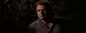 Movie still from “Jubal” (1956), directed by Delmer Daves – A person wearing a gray shirt; Close Up shot, Low angle