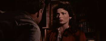 Movie still from “Jubal” (1956), directed by Delmer Daves – A man and a woman are looking at one another; Close Up shot, Over the shoulder angle