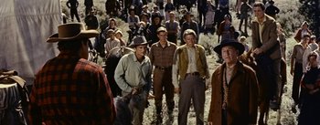 Movie still from “Jubal” (1956), directed by Delmer Daves – A large group of people in a field; Medium shot, Low angle