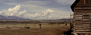 Movie still from “Jubal” (1956), directed by Delmer Daves – An image of an open field with a tent in the background; Extreme Wide shot, Low angle
