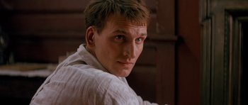 Movie still from “Jude” (1996), directed by Michael Winterbottom – A person wearing a white shirt; Close Up shot, Low angle