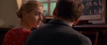 Movie still from “Jude” (1996), directed by Michael Winterbottom – A man and a woman sitting next to each other in front of a window; Close Up shot, Over the shoulder angle