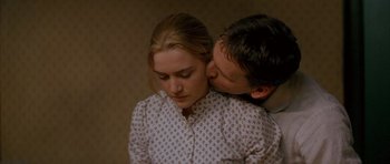 Movie still from “Jude” (1996), directed by Michael Winterbottom – A man kissing a woman on the cheek; Close Up shot, High angle