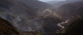 Movie still from “Jude” (1996), directed by Michael Winterbottom – A group of people riding horses on top of a hill; Extreme Wide shot, High angle