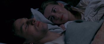 Movie still from “Jude” (1996), directed by Michael Winterbottom – A man and a woman laying in a bed together; Close Up shot, Overhead angle
