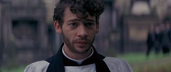 Movie still from “Jude” (1996), directed by Michael Winterbottom – A person wearing a neck tie; Close Up shot, High angle