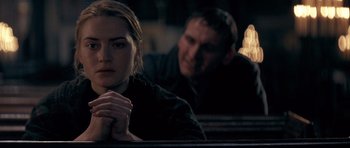 Movie still from “Jude” (1996), directed by Michael Winterbottom – A man and a woman sitting next to each other; Close Up shot, Over the shoulder angle