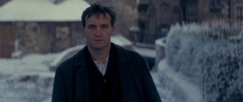 Movie still from “Jude” (1996), directed by Michael Winterbottom – A person wearing a coat; Close Up shot, Low angle