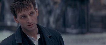 Movie still from “Jude” (1996), directed by Michael Winterbottom – A person wearing a jacket; Close Up shot, Over the shoulder angle