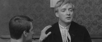 Movie still from “Jules and Jim” (1962), directed by François Truffaut – A man in a suit and a woman in polka dot tie; Close Up shot, Over the shoulder angle