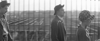 Movie still from “Jules and Jim” (1962), directed by François Truffaut – A black and white photo of a man wearing a hat; Close Up shot, Low angle
