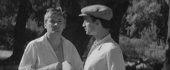Movie still from “Jules and Jim” (1962), directed by François Truffaut – Two young men standing next to each other; Close Up shot, High angle