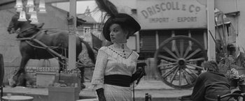 Movie still from “Jules and Jim” (1962), directed by François Truffaut – A woman in an old fashioned dress with a hat on; Medium shot, Low angle