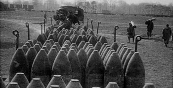 Movie still from “Jules and Jim” (1962), directed by François Truffaut – An old photo of a field full of shells; Extreme Wide shot, High angle