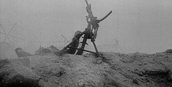 Movie still from “Jules and Jim” (1962), directed by François Truffaut – An image of an old time machine in the dirt; Wide shot, High angle