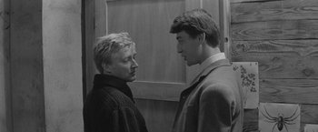 Movie still from “Jules and Jim” (1962), directed by François Truffaut – Two people standing next to each other face to face; Medium shot, Low angle