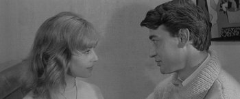 Movie still from “Jules and Jim” (1962), directed by François Truffaut – A man and a woman face to face in a black and white photo; Close Up shot, High angle