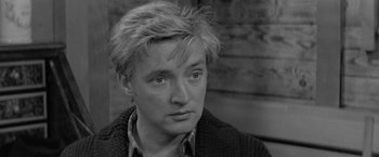 Movie still from “Jules and Jim” (1962), directed by François Truffaut – A black and white photo of a man with short blonde hair; Close Up shot, High angle