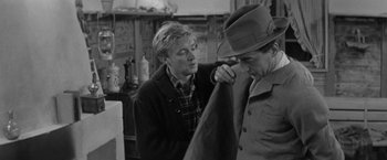 Movie still from “Jules and Jim” (1962), directed by François Truffaut – A man putting a hat on another man's head; Medium shot, Over the shoulder angle
