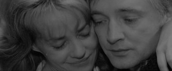 Movie still from “Jules and Jim” (1962), directed by François Truffaut – A woman and a man's face; Extreme Close Up shot, High angle