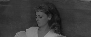 Movie still from “Jules and Jim” (1962), directed by François Truffaut – A black - and - white photo of a woman with long hair; Close Up shot, High angle