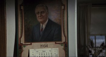 Movie still from “Julia” (1977), directed by Fred Zinnemann – A painting of president franklin d; Close Up shot, Over the shoulder angle