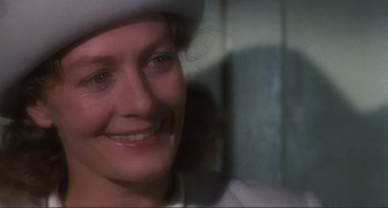 Movie still from “Julia” (1977), directed by Fred Zinnemann – A person wearing a white hat; Close Up shot, Over the shoulder angle