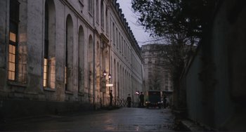 Movie still from “Julia” (1977), directed by Fred Zinnemann – A city street with people standing on the sidewalk; Extreme Wide shot, High angle