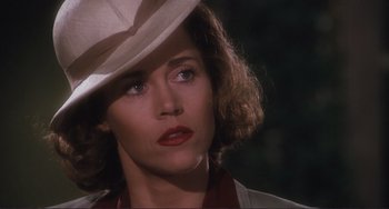 Movie still from “Julia” (1977), directed by Fred Zinnemann – A person wearing a hat; Close Up shot, Over the shoulder angle