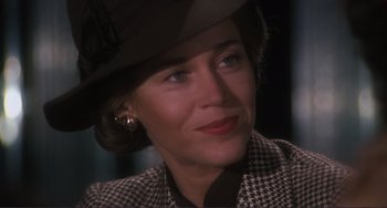 Movie still from “Julia” (1977), directed by Fred Zinnemann – A person wearing a hat; Close Up shot, Over the shoulder angle