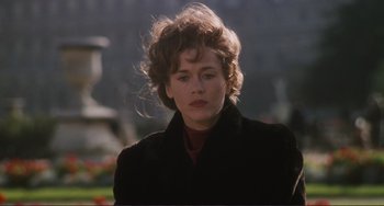 Movie still from “Julia” (1977), directed by Fred Zinnemann – A young woman with short brown hair wearing a black coat; Close Up shot, Over the shoulder angle