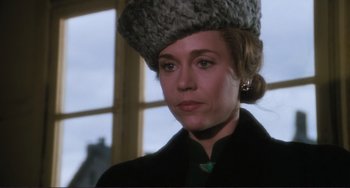 Movie still from “Julia” (1977), directed by Fred Zinnemann – A person wearing a hat; Close Up shot, Over the shoulder angle
