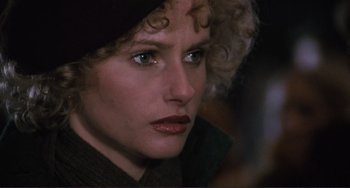 Movie still from “Julia” (1977), directed by Fred Zinnemann – A person wearing a hat and looking at the camera; Close Up shot, Over the shoulder angle