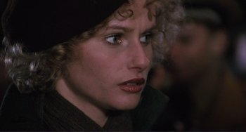 Movie still from “Julia” (1977), directed by Fred Zinnemann – A person wearing a hat and looking to the side; Close Up shot, Over the shoulder angle
