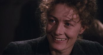 Movie still from “Julia” (1977), directed by Fred Zinnemann – A person smiling; Close Up shot, Over the shoulder angle