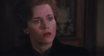 Movie still from “Julia” (1977), directed by Fred Zinnemann – A person with a crying face; Close Up shot, Over the shoulder angle