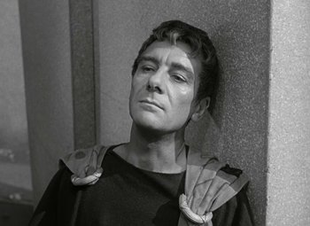 Movie still from “Julius Caesar” (1953), directed by Joseph L. Mankiewicz – A black and white photo of a man in a roman costume; Close Up shot, High angle