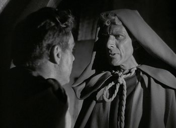 Movie still from “Julius Caesar” (1953), directed by Joseph L. Mankiewicz – An old photo of a man looking at another man; Close Up shot, Over the shoulder angle