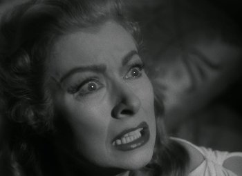 Movie still from “Julius Caesar” (1953), directed by Joseph L. Mankiewicz – An old photo of a woman looking angry at the camera; Close Up shot, Low angle