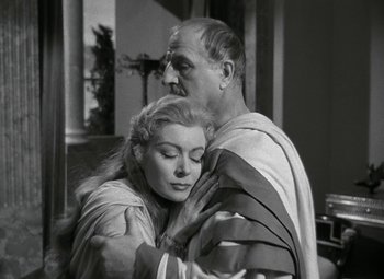 Movie still from “Julius Caesar” (1953), directed by Joseph L. Mankiewicz – A man and a woman in roman garb embracing each other; Close Up shot, Low angle