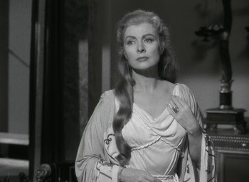 Movie still from “Julius Caesar” (1953), directed by Joseph L. Mankiewicz – A black and white photo of a woman with long hair; Close Up shot, Over the shoulder angle