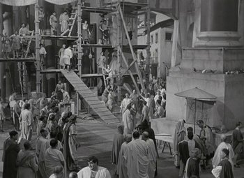 Movie still from “Julius Caesar” (1953), directed by Joseph L. Mankiewicz – A group of people standing around in a building; Extreme Wide shot, High angle