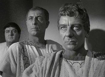 Movie still from “Julius Caesar” (1953), directed by Joseph L. Mankiewicz – A black - and - white photo of two men in roman garb; Close Up shot, Low angle